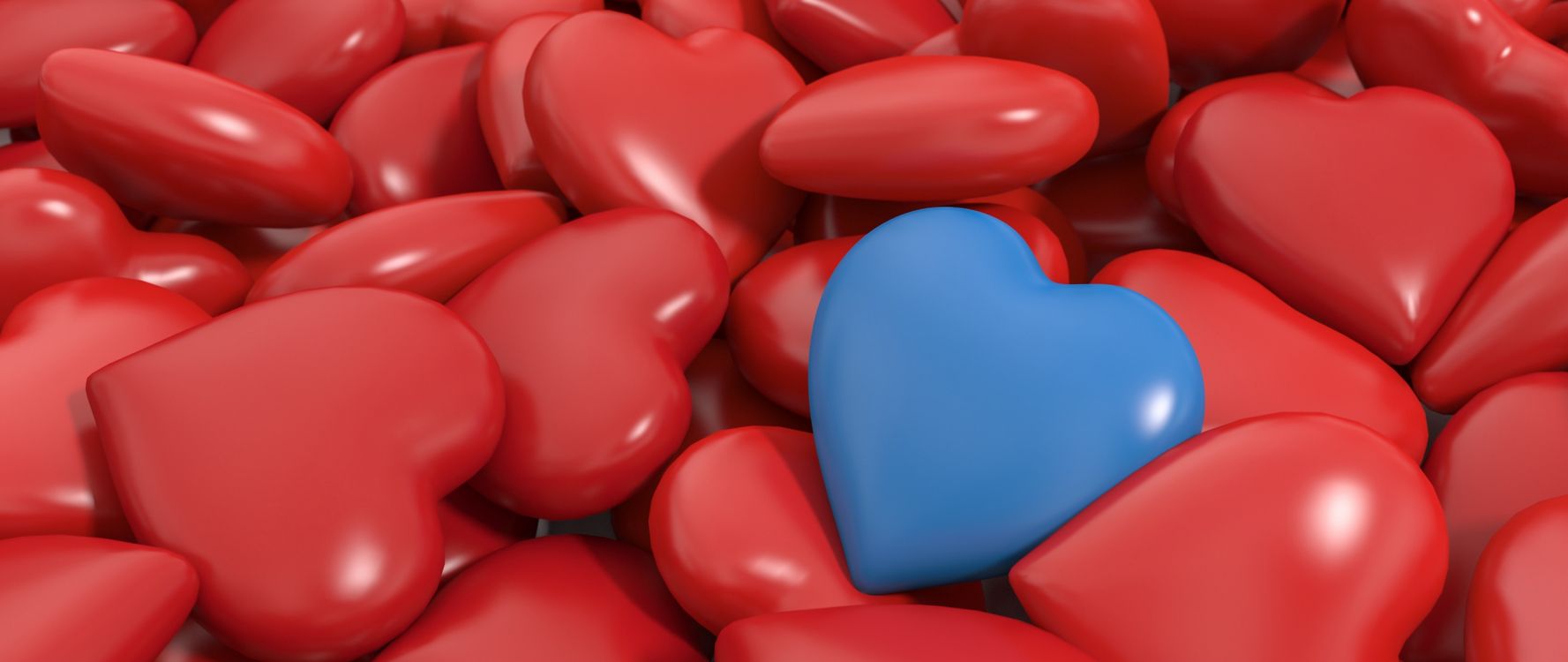 Red Plastic Heart Shaped Toy. Wallpaper in 2560x1080 Resolution