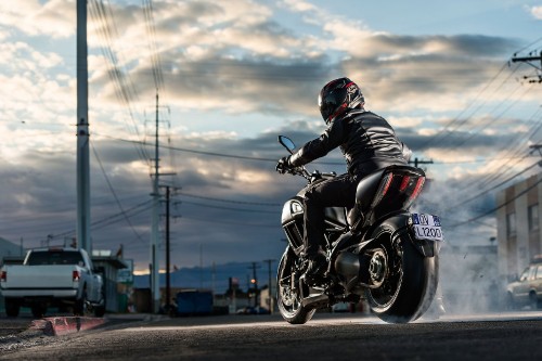 Image man in black motorcycle helmet riding motorcycle on road during daytime