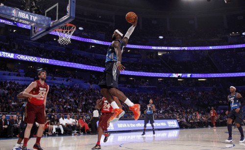 Image man in black jersey shirt and shorts playing basketball