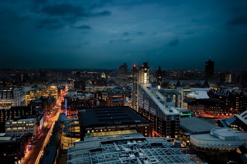 Image city with high rise buildings during night time