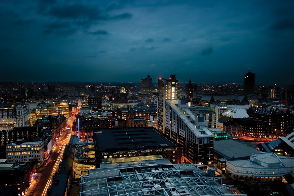 city with high rise buildings during night time