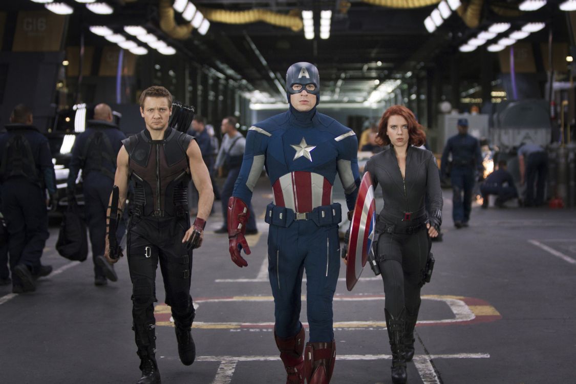 man in black and red captain america costume standing beside man in black and red jersey