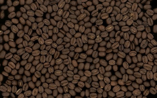 Image coffee beans on brown wooden surface