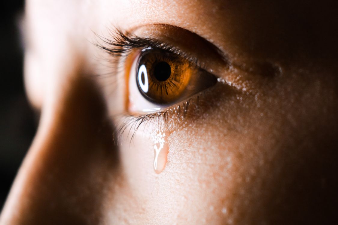 persons eye in close up photography