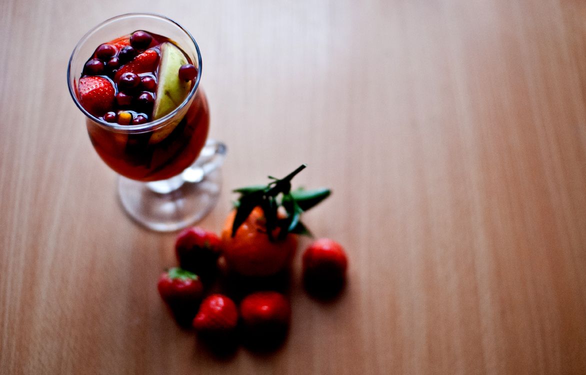 red cherries in clear glass cup