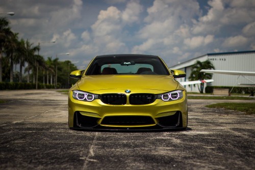 Image yellow bmw m 3 on road during daytime