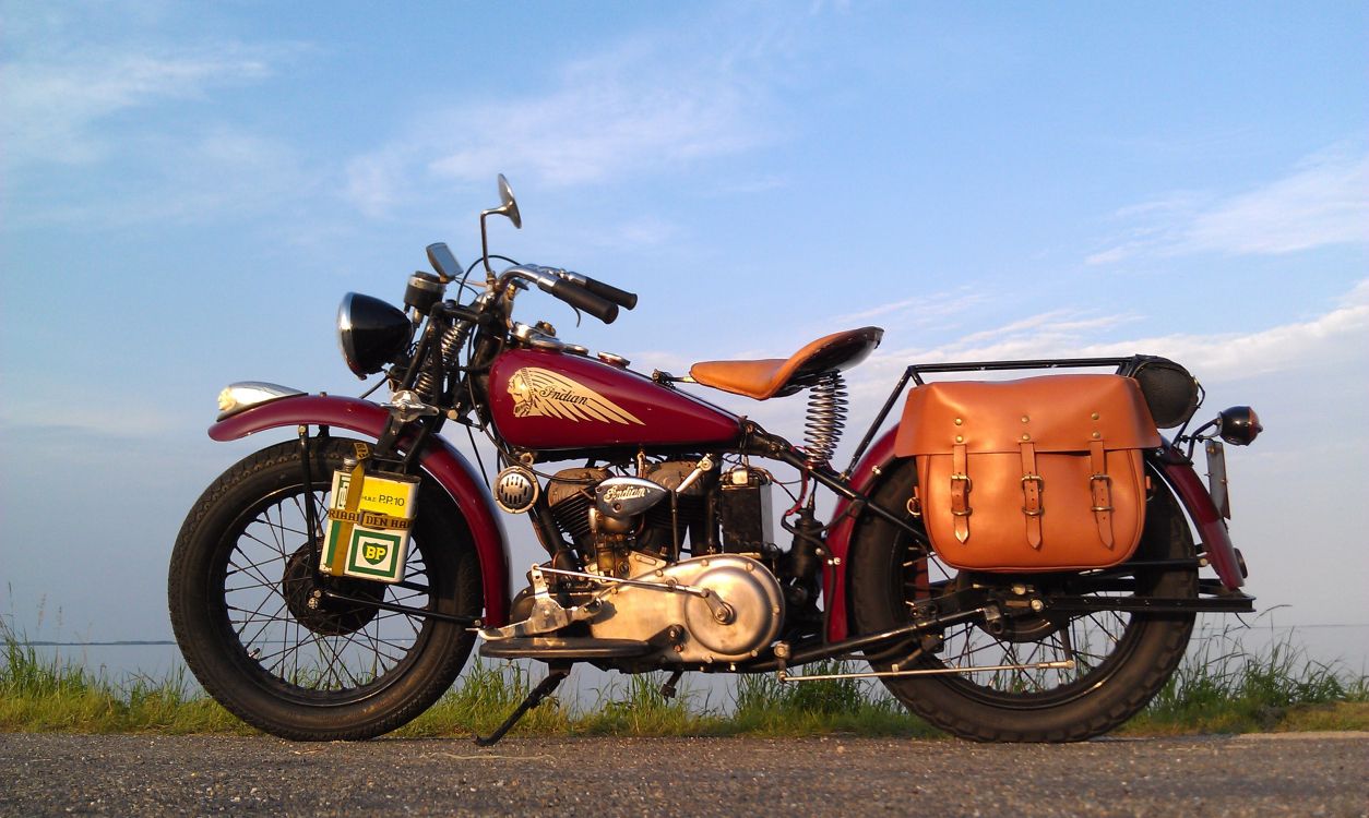 Orange and Black Motorcycle on Green Grass Field Under Blue Sky During Daytime. Wallpaper in 3264x1952 Resolution