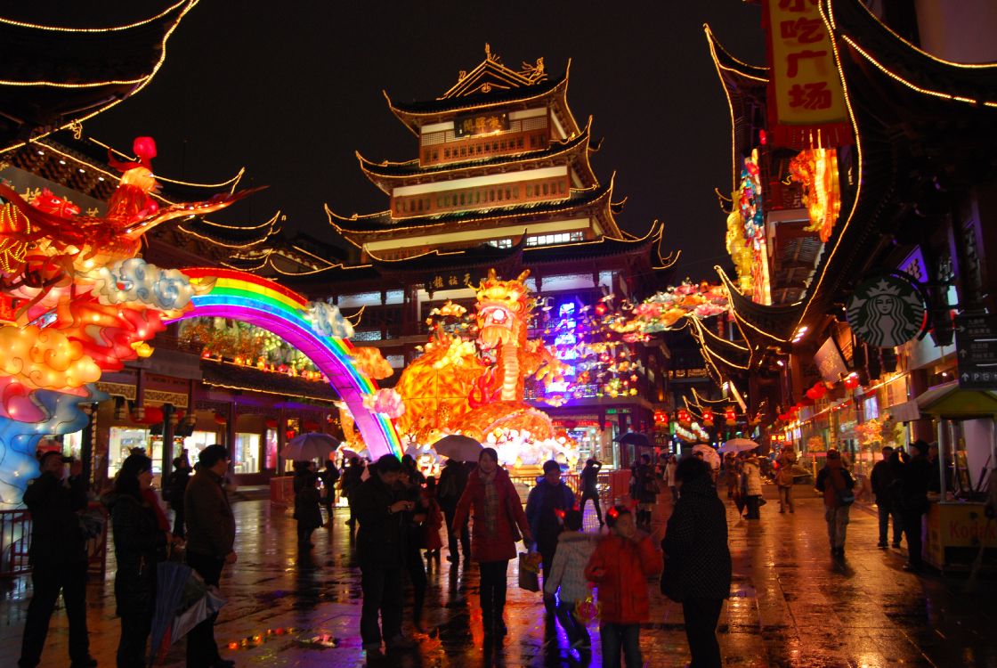 people walking on street during nighttime