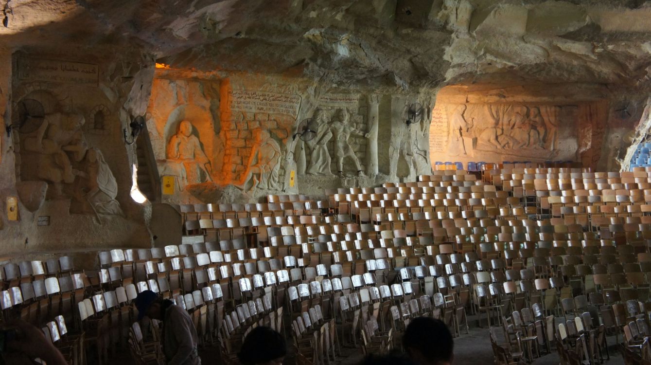 people sitting on chairs inside building