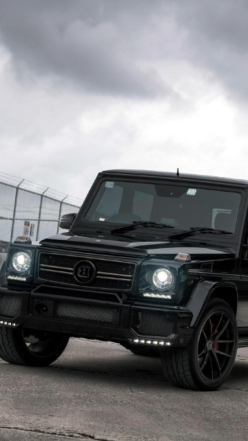 Image black suv parked beside blue and white building