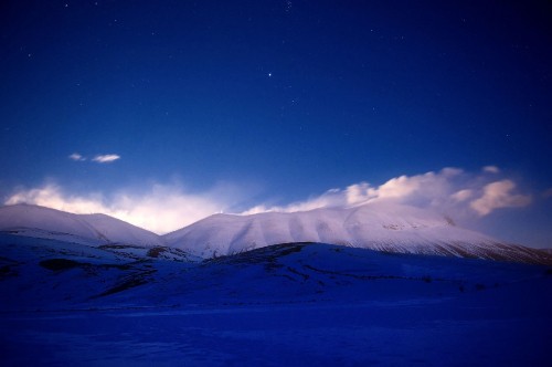 Image snow covered mountain under blue sky during daytime