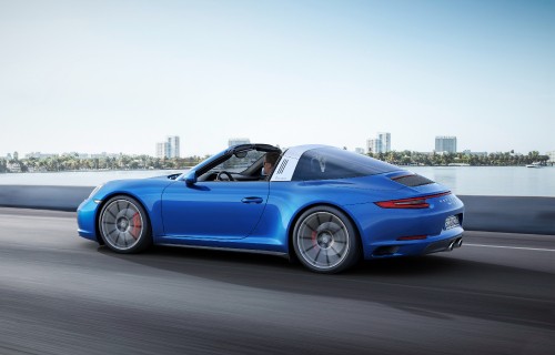 Image blue porsche 911 on gray asphalt road during daytime