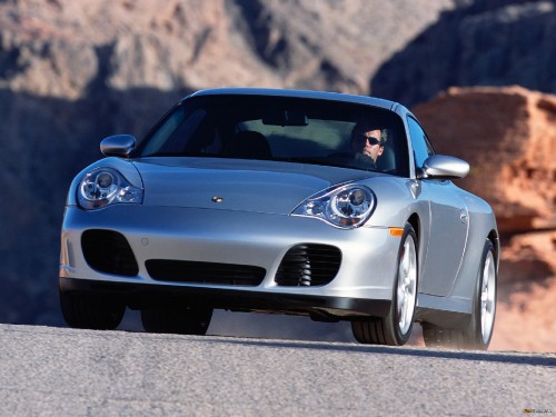 Image grey porsche 911 on grey concrete road during daytime