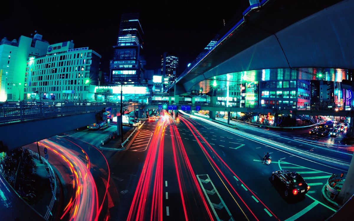 time lapse photography of cars on road during night time