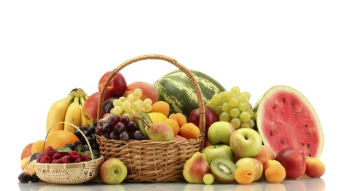 Image green and yellow apples in brown woven basket