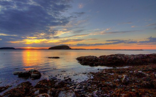 Image body of water under blue sky during sunset