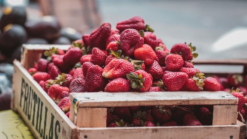 Image red strawberries on brown wooden crate