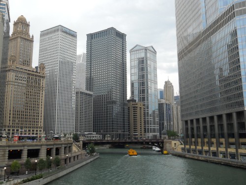 Image white and gray concrete building near body of water during daytime