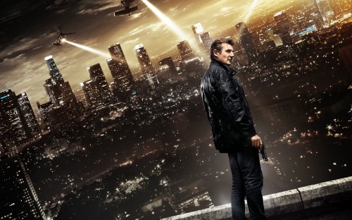 Image man in black leather jacket standing on the street during night time