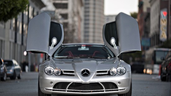 Image silver mercedes benz car in front of brown brick building