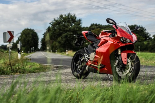 Image red and black sports bike on road during daytime