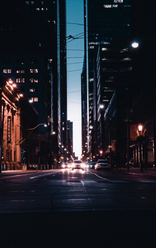 Image people walking on street during night time