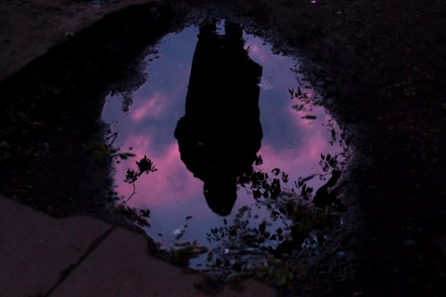 Image reflection of purple and pink water