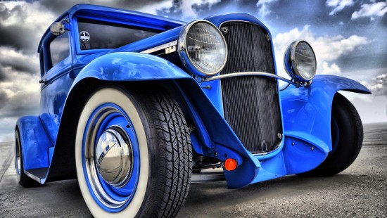 Image blue and silver car on gray asphalt road during daytime