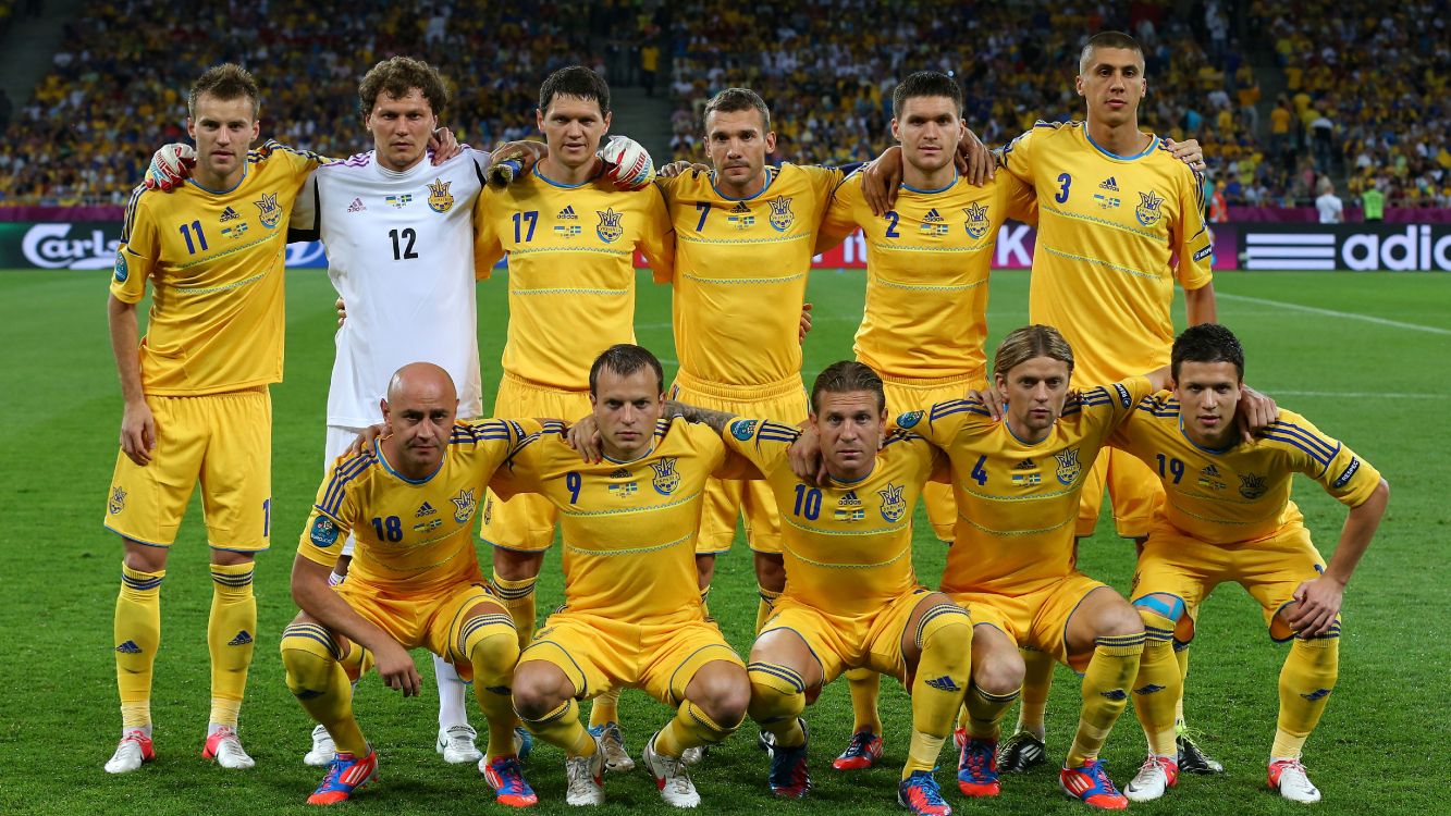 group of children in yellow soccer jersey