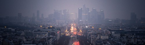 Image city with high rise buildings during night time