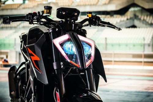 Image black and red motorcycle on road during daytime