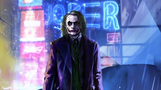 Image man in black suit jacket standing in front of blue and red neon light signage
