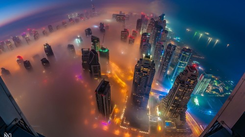 Image high rise buildings during night time