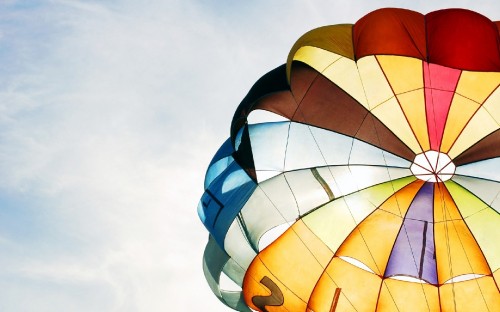 Image yellow blue and red hot air balloon in mid air