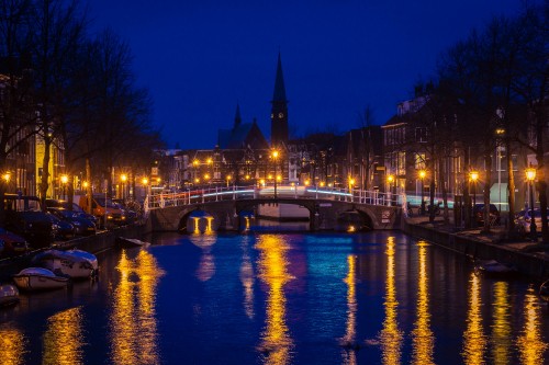 Image body of water near building during night time