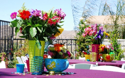 Image red and pink flowers in blue ceramic vase