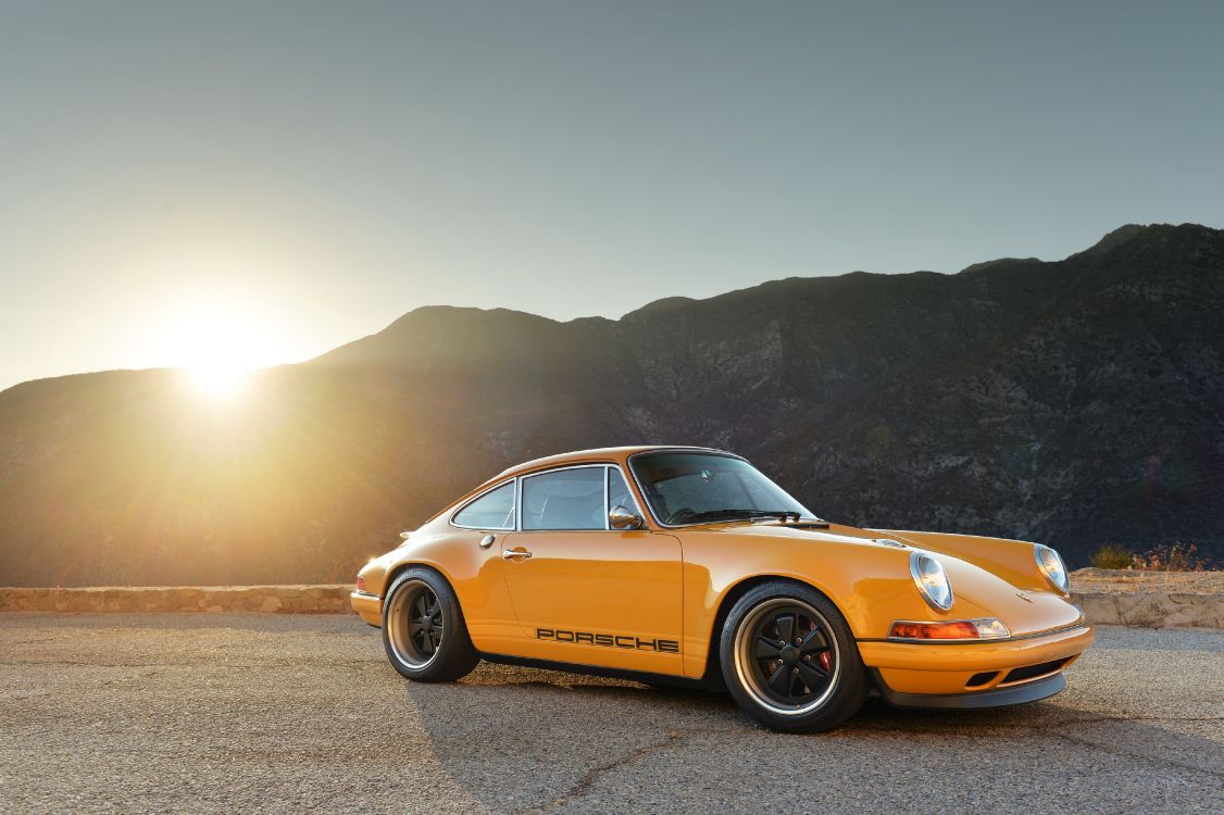 Yellow Porsche 911 on Brown Dirt Road During Daytime. Wallpaper in 4096x2726 Resolution