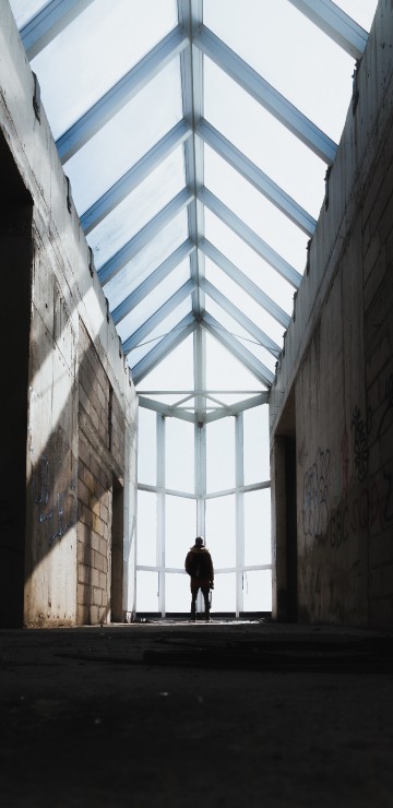 Image person walking on hallway during daytime