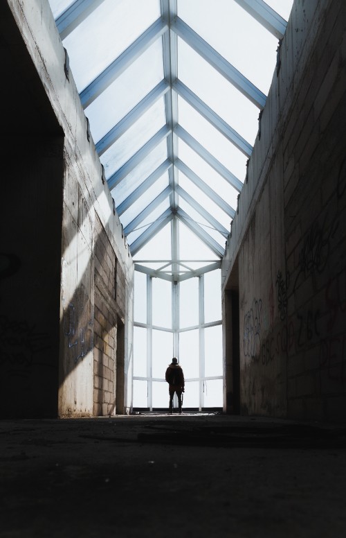 Image person walking on hallway during daytime