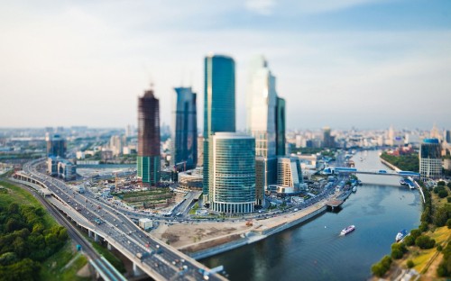 Image high rise buildings near body of water during daytime