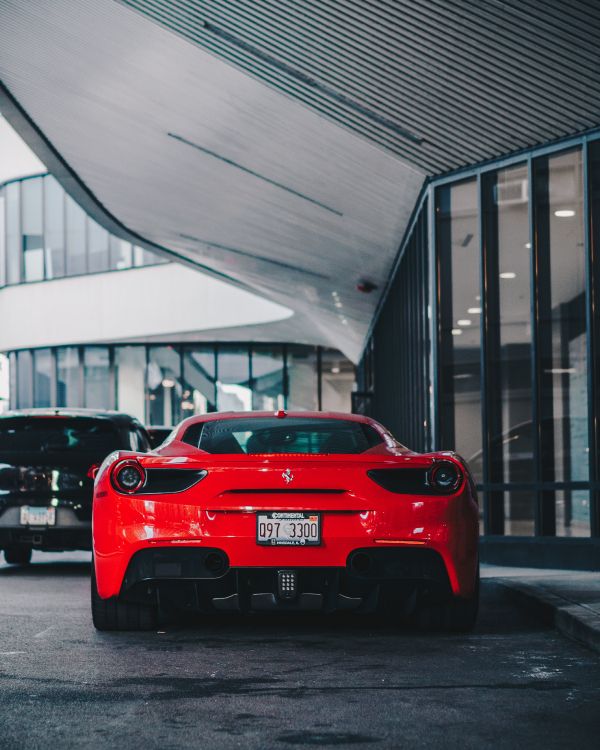 Ferrari Rojo Aparcado Cerca Del Edificio. Wallpaper in 3926x4907 Resolution