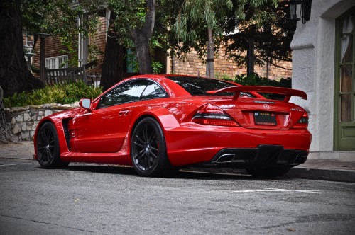 Image red ferrari 458 italia parked on road near trees during daytime