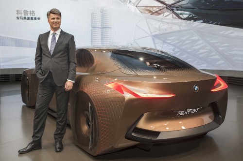 Image man in black suit standing beside red car