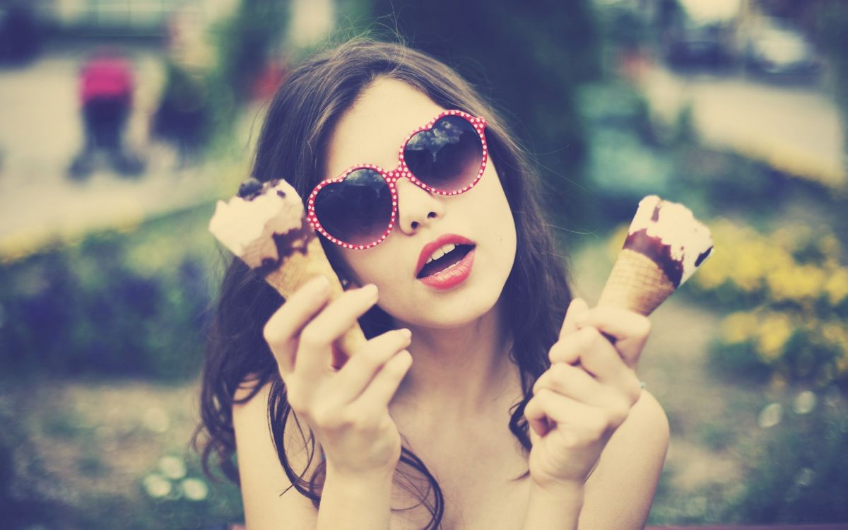 woman in red lipstick holding ice cream cone