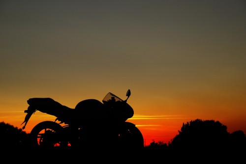 Image silhouette of motorcycle during sunset