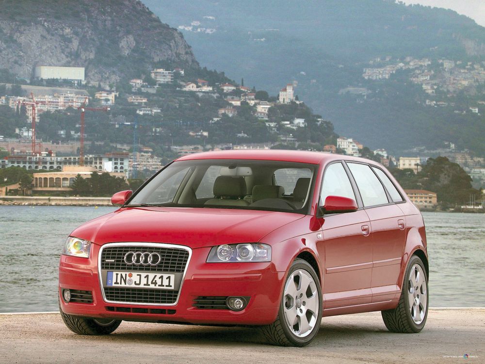 red audi suv on road during daytime