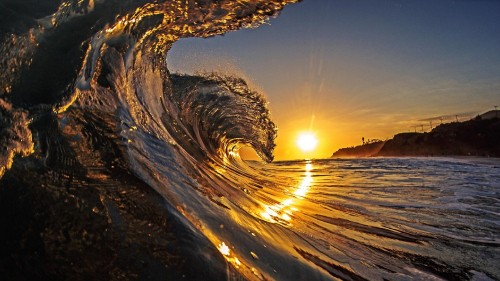 Image time lapse photography of water wave during sunset