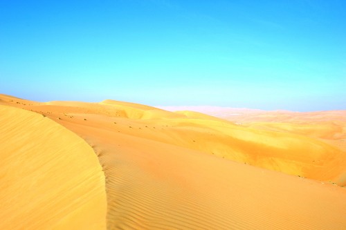 Image brown sand under blue sky during daytime