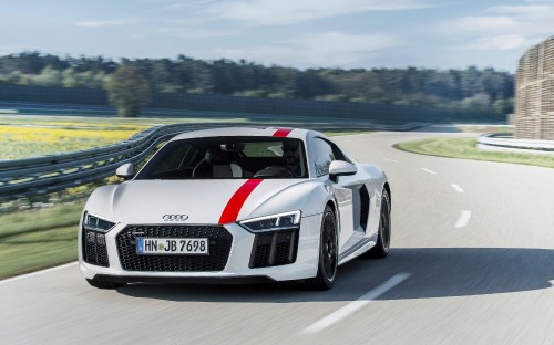 Image white and black audi r 8 on road during daytime