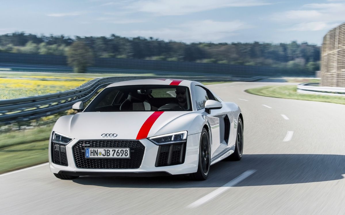 white and black audi r 8 on road during daytime